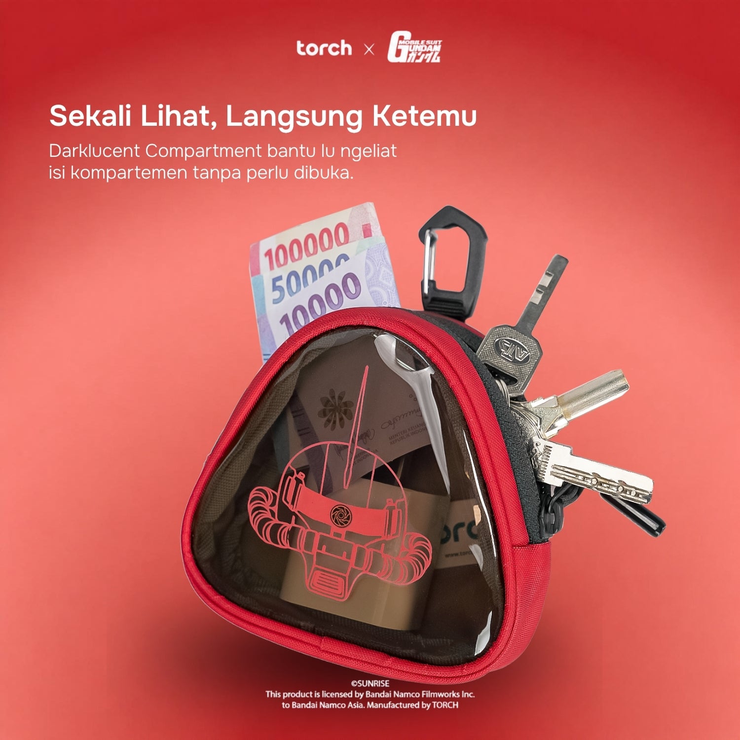 A red zippered pouch with a transparent front pocket, shown with keys, a car key fob, and cash inside on a red gradient background. Indonesian marketing text appears at the top, along with Torch and Cactus Brand logos.