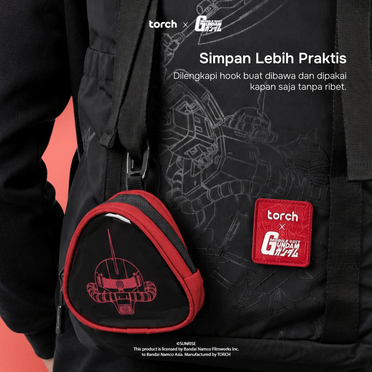 Black backpack with a red and black triangular Gundam pouch, featuring a red patch with 'torch x GUNDAM' and white promotional text on a black background.